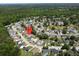 This aerial view captures a serene neighborhood with tree-lined streets and houses, offering a peaceful setting at 203 Two Hitch Rd, Goose Creek, SC 29445