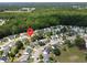 This aerial view captures a serene neighborhood with tree-lined streets and houses, offering a peaceful setting at 203 Two Hitch Rd, Goose Creek, SC 29445