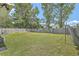 Large backyard with well-maintained grass and a wooden fence at 203 Two Hitch Rd, Goose Creek, SC 29445
