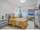 Bedroom features two bright windows, light wood flooring and a well-organized closet at 203 Two Hitch Rd, Goose Creek, SC 29445