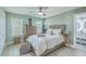 Sunlit bedroom with a comfortable bed, light-colored walls, and an ensuite bathroom at 203 Two Hitch Rd, Goose Creek, SC 29445