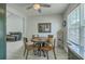 Cozy dining room featuring a modern round table, adjacent to a kitchen with plenty of sunlight at 203 Two Hitch Rd, Goose Creek, SC 29445