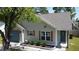Well-maintained single-story home with tidy landscaping, complemented by a coordinating door and garage at 203 Two Hitch Rd, Goose Creek, SC 29445