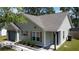 Attractive single-story home featuring a blue garage door and complemented by trimmed front yard landscaping at 203 Two Hitch Rd, Goose Creek, SC 29445