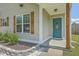 Inviting front entry boasts a teal door, decorative shutters, and manicured landscaping enhancing the curb appeal at 203 Two Hitch Rd, Goose Creek, SC 29445