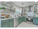 Modern kitchen showcasing granite countertops, stainless steel appliances, and stylish green cabinets at 203 Two Hitch Rd, Goose Creek, SC 29445