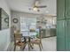Bright eat-in kitchen features green cabinets, modern appliances, and a cozy dining area with natural light at 203 Two Hitch Rd, Goose Creek, SC 29445
