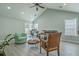 Spacious living room with vaulted ceilings, large windows, modern furniture, and a fireplace providing a cozy atmosphere at 203 Two Hitch Rd, Goose Creek, SC 29445