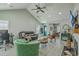 Open living room features a vaulted ceiling, fireplace, neutral walls, and cohesive decor, flooded with natural light at 203 Two Hitch Rd, Goose Creek, SC 29445