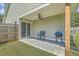 Backyard patio features a ceiling fan, an outdoor chair, and a grill at 203 Two Hitch Rd, Goose Creek, SC 29445