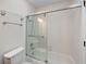 A bathroom featuring a bathtub with a glass door and a tiled shower head at 205 Lynton Ct, Goose Creek, SC 29445