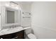 Charming half bathroom with modern fixtures, a marble countertop, and stylish wainscoting at 205 Lynton Ct, Goose Creek, SC 29445