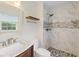 A bathroom with a marble vanity, and a tiled walk-in shower with a shower caddy at 205 Lynton Ct, Goose Creek, SC 29445