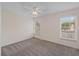 A bright bedroom features neutral carpet and two windows that allow natural light to stream in at 205 Lynton Ct, Goose Creek, SC 29445