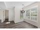 Inviting dining area featuring modern vinyl floors, an elegant pendant light, and lots of natural light at 205 Lynton Ct, Goose Creek, SC 29445