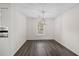 Bright dining room featuring modern vinyl floors, a pendant light, neutral paint, and lots of natural light at 205 Lynton Ct, Goose Creek, SC 29445