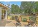 Inviting back deck with seating, offering a tranquil view of the landscaped backyard and pool at 2275 Pristine View Rd, Charleston, SC 29414
