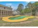 The backyard features a swimming pool with yellow painted trim, perfect for summer fun at 2275 Pristine View Rd, Charleston, SC 29414