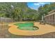 The backyard features a swimming pool with yellow painted trim, set within a lush, green landscape at 2275 Pristine View Rd, Charleston, SC 29414