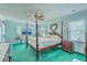 Large bedroom with four poster bed, wood furniture, and flat screen TV at 2275 Pristine View Rd, Charleston, SC 29414