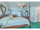 Bright bedroom featuring a four-poster bed, wood furniture, and decorative heart at 2275 Pristine View Rd, Charleston, SC 29414