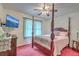 Charming bedroom with a four-poster bed, ceiling fan, and flat screen TV at 2275 Pristine View Rd, Charleston, SC 29414