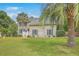 Two-story home with a well-manicured lawn and mature trees at 2275 Pristine View Rd, Charleston, SC 29414