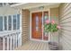 Elegant front door with decorative glass and pink Hibiscus at 2275 Pristine View Rd, Charleston, SC 29414