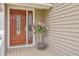 Elegant front door with decorative glass and pink Hibiscus at 2275 Pristine View Rd, Charleston, SC 29414