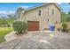 Attached garage with a wood garage door and a concrete driveway at 2275 Pristine View Rd, Charleston, SC 29414