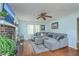 Living room with fireplace, hardwood flooring, and a large sectional at 2275 Pristine View Rd, Charleston, SC 29414