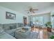 Living room with hardwood flooring, fireplace, and a large sectional at 2275 Pristine View Rd, Charleston, SC 29414