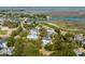 Stunning aerial view of a luxury community with marsh views, a golf course, and beautiful landscaping at 23 Fairway Village Ln, Isle of Palms, SC 29451