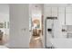 Hallway view to a dining area with bright light and views from the kitchen at 23 Fairway Village Ln, Isle of Palms, SC 29451