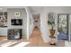 Hallway featuring wood floors, modern decor, and sliding glass doors that open to outdoor views at 23 Fairway Village Ln, Isle of Palms, SC 29451
