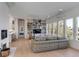 Spacious living room featuring bright windows, built-in bookshelves, and hardwood flooring at 23 Fairway Village Ln, Isle of Palms, SC 29451