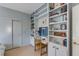 Study with built-in shelving providing ample storage and display space around the work area at 23 Fairway Village Ln, Isle of Palms, SC 29451
