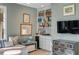 Stylish sitting room featuring built-in shelves, drawers, and a comfortable cushioned bench at 23 Fairway Village Ln, Isle of Palms, SC 29451