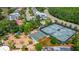 Aerial view of community amenities, including tennis and basketball courts, playground, and neighborhood streets at 2408 Bending Oak Loop, Mount Pleasant, SC 29466