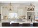 Modern kitchen featuring a large island, pendant lighting, stainless steel appliances, and tile backsplash at 2408 Bending Oak Loop, Mount Pleasant, SC 29466