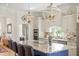 Elegant kitchen with a granite island, modern pendant lights, and stainless steel appliances at 2408 Bending Oak Loop, Mount Pleasant, SC 29466