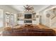 Comfortable living room features a brick fireplace and a view of the outdoor patio at 2408 Bending Oak Loop, Mount Pleasant, SC 29466