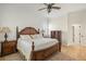 Spacious bedroom with hardwood floors, ceiling fan, shiplap accent wall, and a decorative rug at 2408 Bending Oak Loop, Mount Pleasant, SC 29466
