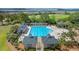 Stunning community pool with ample lounge chairs and sunbathing areas, surrounded by lush landscaping and trees at 2408 Bending Oak Loop, Mount Pleasant, SC 29466