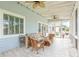 Relaxing screened porch featuring comfortable seating and ceiling fans, ideal for outdoor enjoyment at 2408 Bending Oak Loop, Mount Pleasant, SC 29466