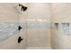 Modern shower with gray and blue accent tiles, multiple shower heads, and built-in shelves at 2408 Bending Oak Loop, Mount Pleasant, SC 29466