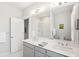 Stylish bathroom featuring double sinks, white cabinets, and a glass shower at 2815 Colonel Harrison Dr, Johns Island, SC 29455