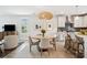 Open floor plan showcasing the dining area, eat-in kitchen, and living room with natural light at 2815 Colonel Harrison Dr, Johns Island, SC 29455