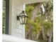 A classic exterior lantern is mounted beside the front door, casting a warm glow at 2815 Colonel Harrison Dr, Johns Island, SC 29455
