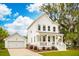 Charming two-story home with white siding, a inviting front porch and a detached garage at 2815 Colonel Harrison Dr, Johns Island, SC 29455